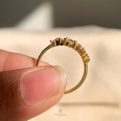 Classic gold ring featuring shimmering moissanite diamond cluster