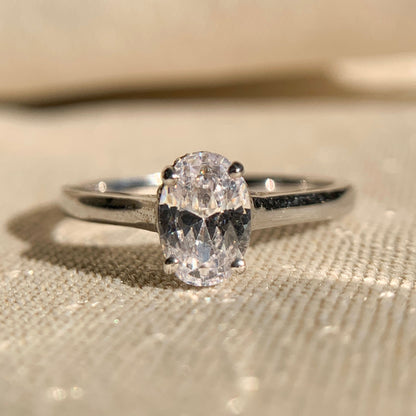 14k white gold oval cut solitaire engagement ring on display