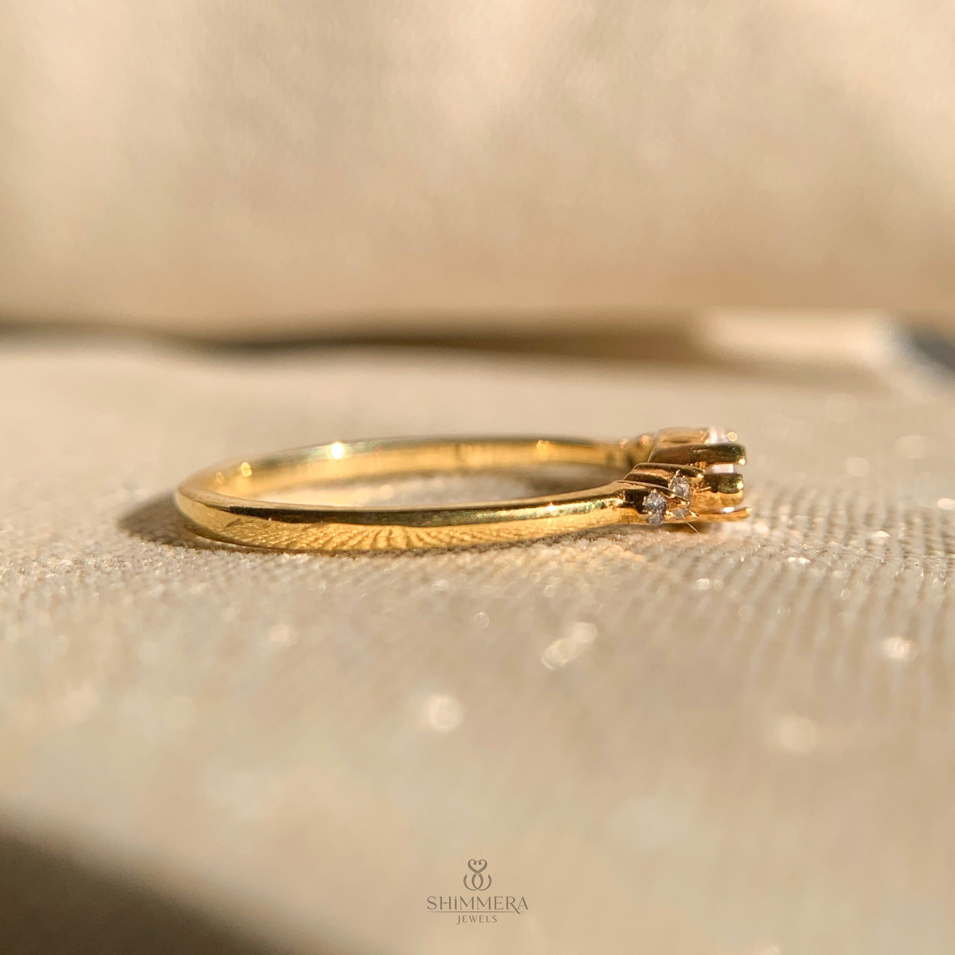 Contemporary east-west marquise solitaire ring in polished gold