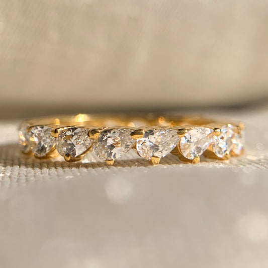 Elegant moissanite pear diamond eternity band in white gold