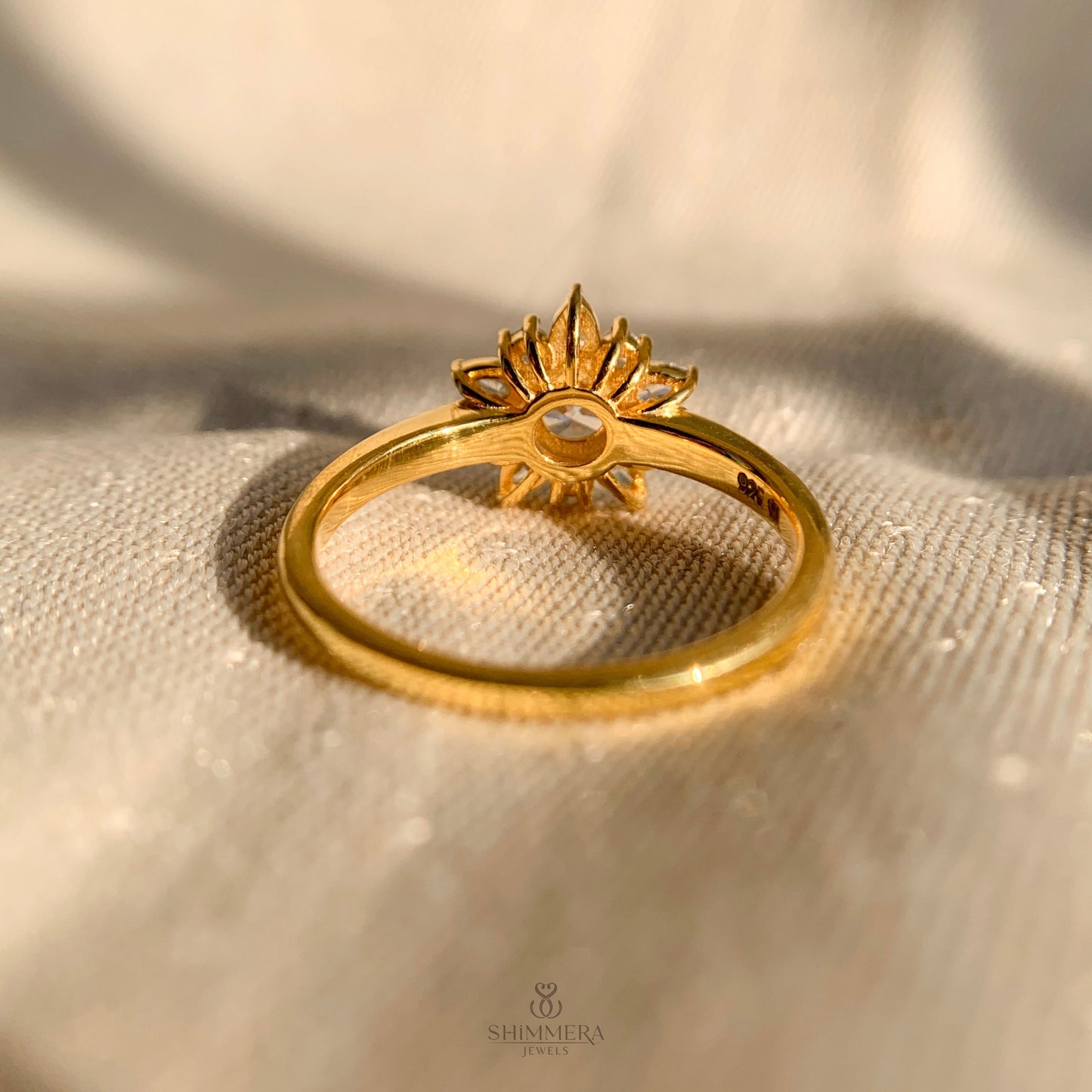 Modern cluster ring with round diamonds and pear accents