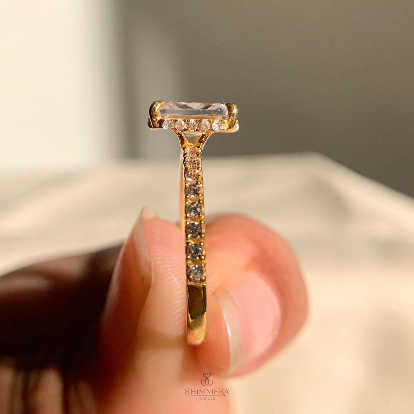 Radiant cut moissanite engagement ring featuring hidden diamond halo