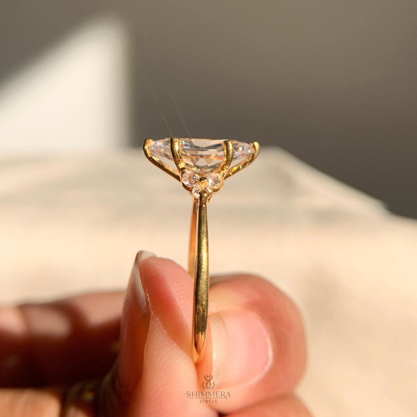 Marquise Engagement Ring With Round Side Stones