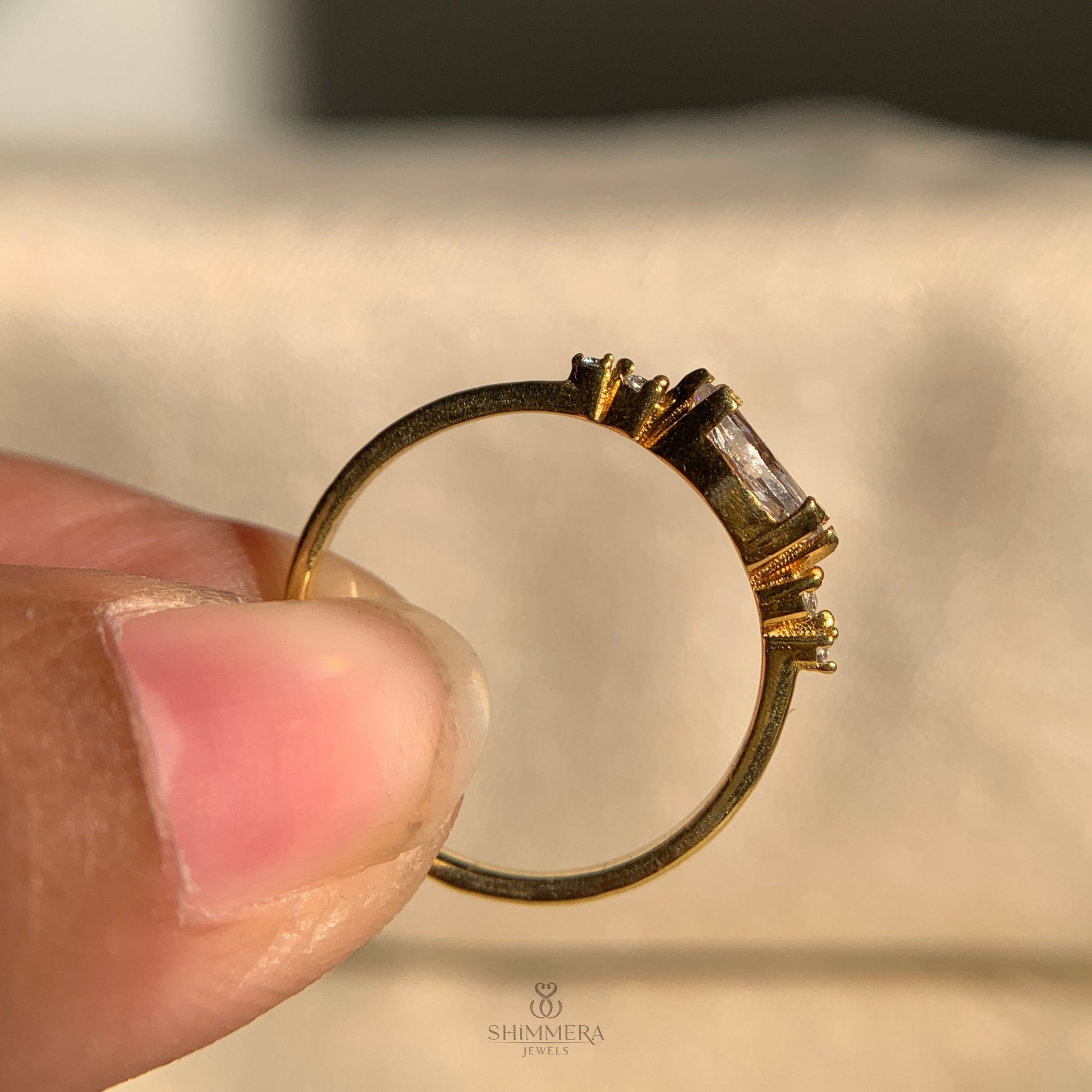 Timeless marquise diamond ring set sideways on gold shank