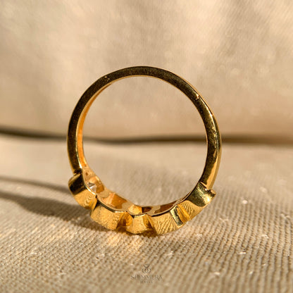 Bezel setting diamond band featuring round, marquise, and oval stones