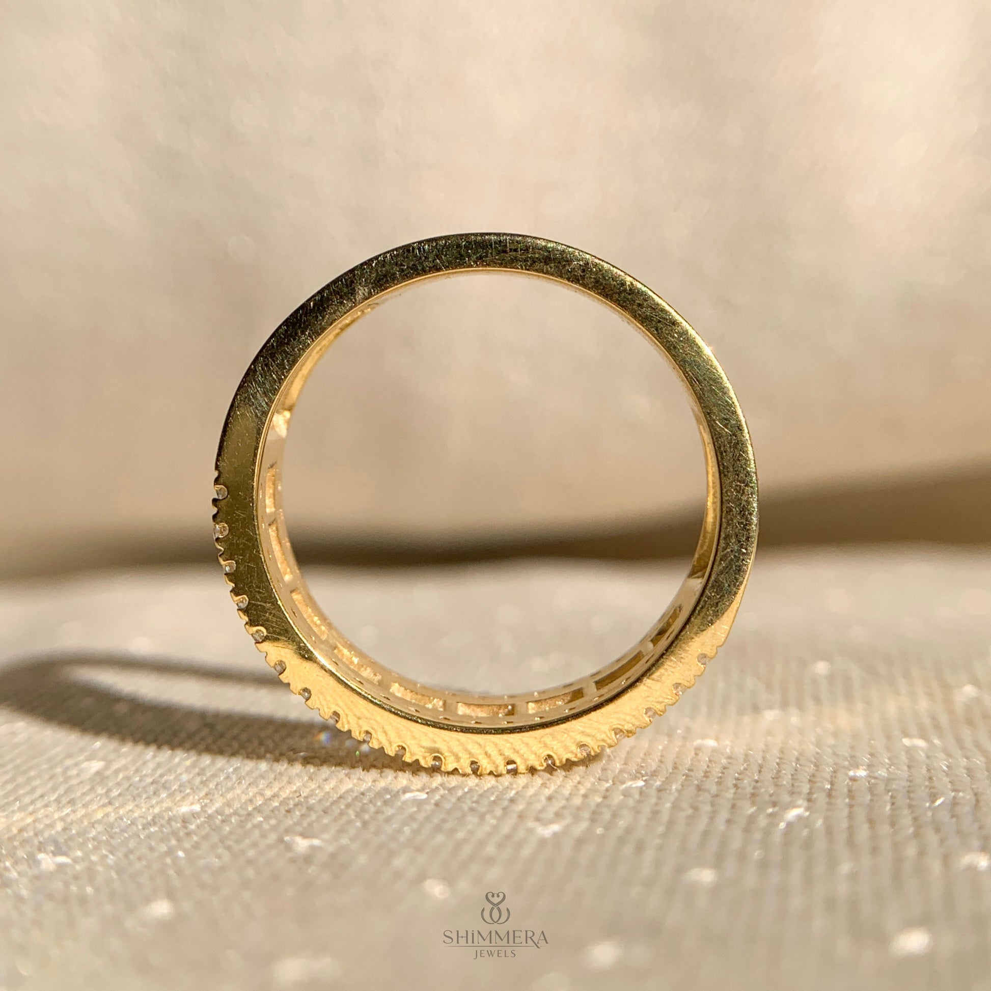 Half eternity diamond band with alternating baguette and round cuts
