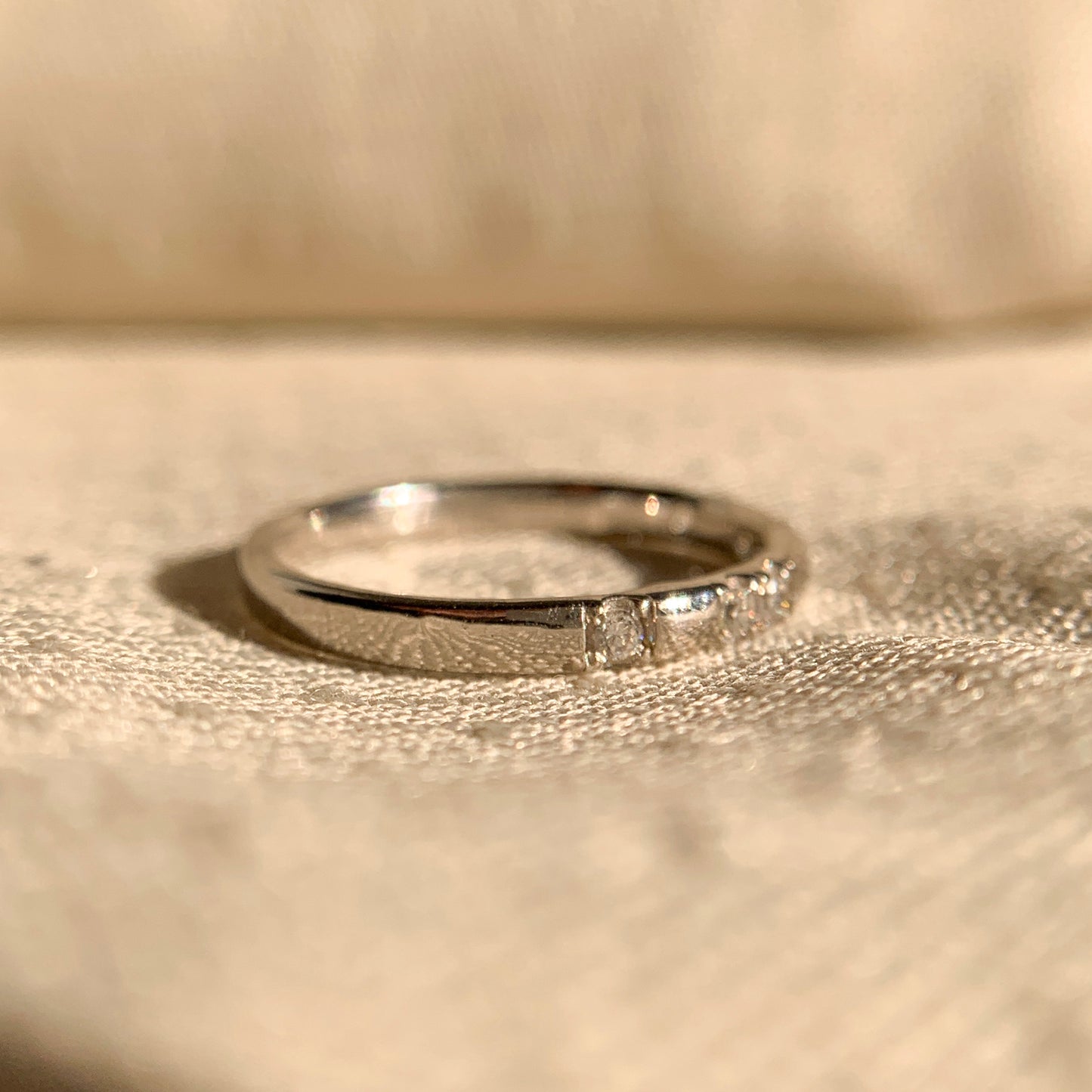 Minimalist 14k gold wedding ring with round brilliant diamond accents