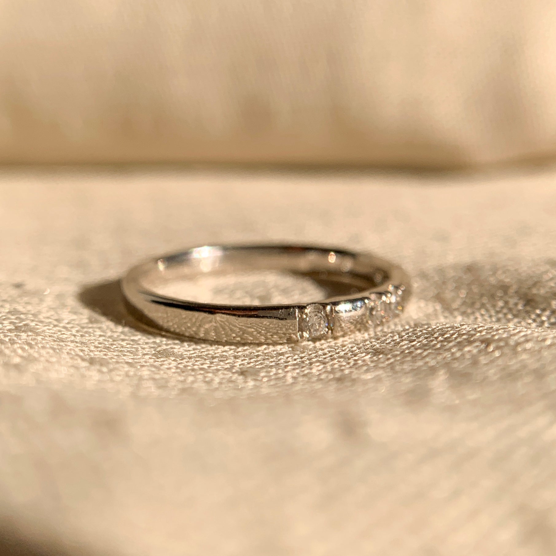 Minimalist 14k gold wedding ring with round brilliant diamond accents