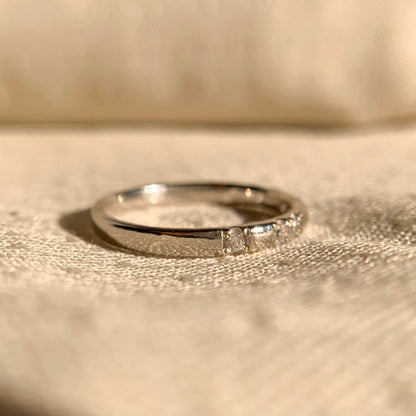 Minimalist 14k gold wedding ring with round brilliant diamond accents